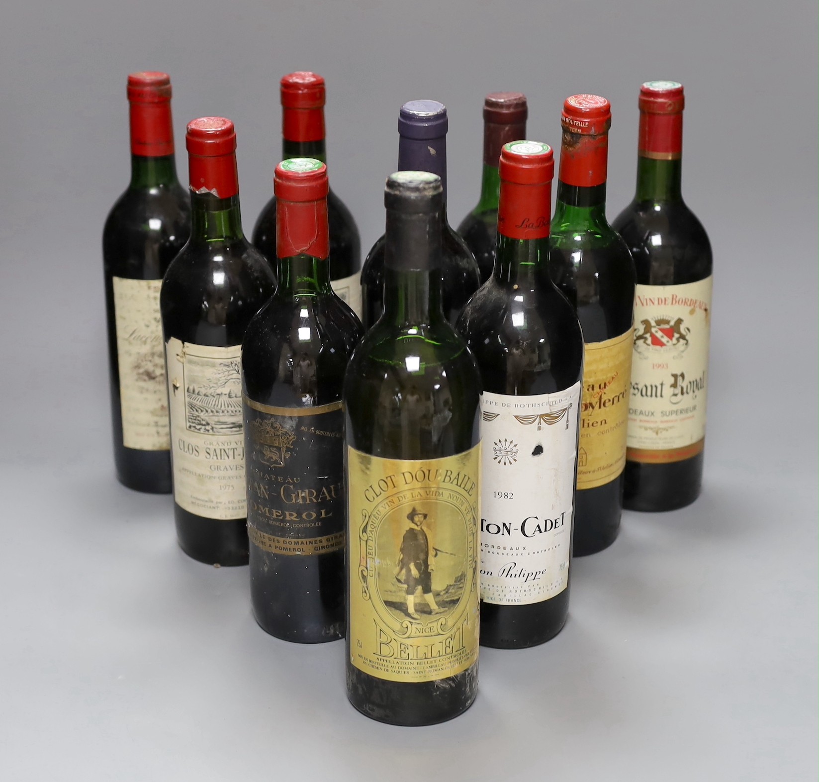 Ten bottles of various wine to include 1975 Clos Saint-Jerome, 1982 Baron Philippe Mouton Cadet, 1985 Chateau Lacombe-Noaillac and others